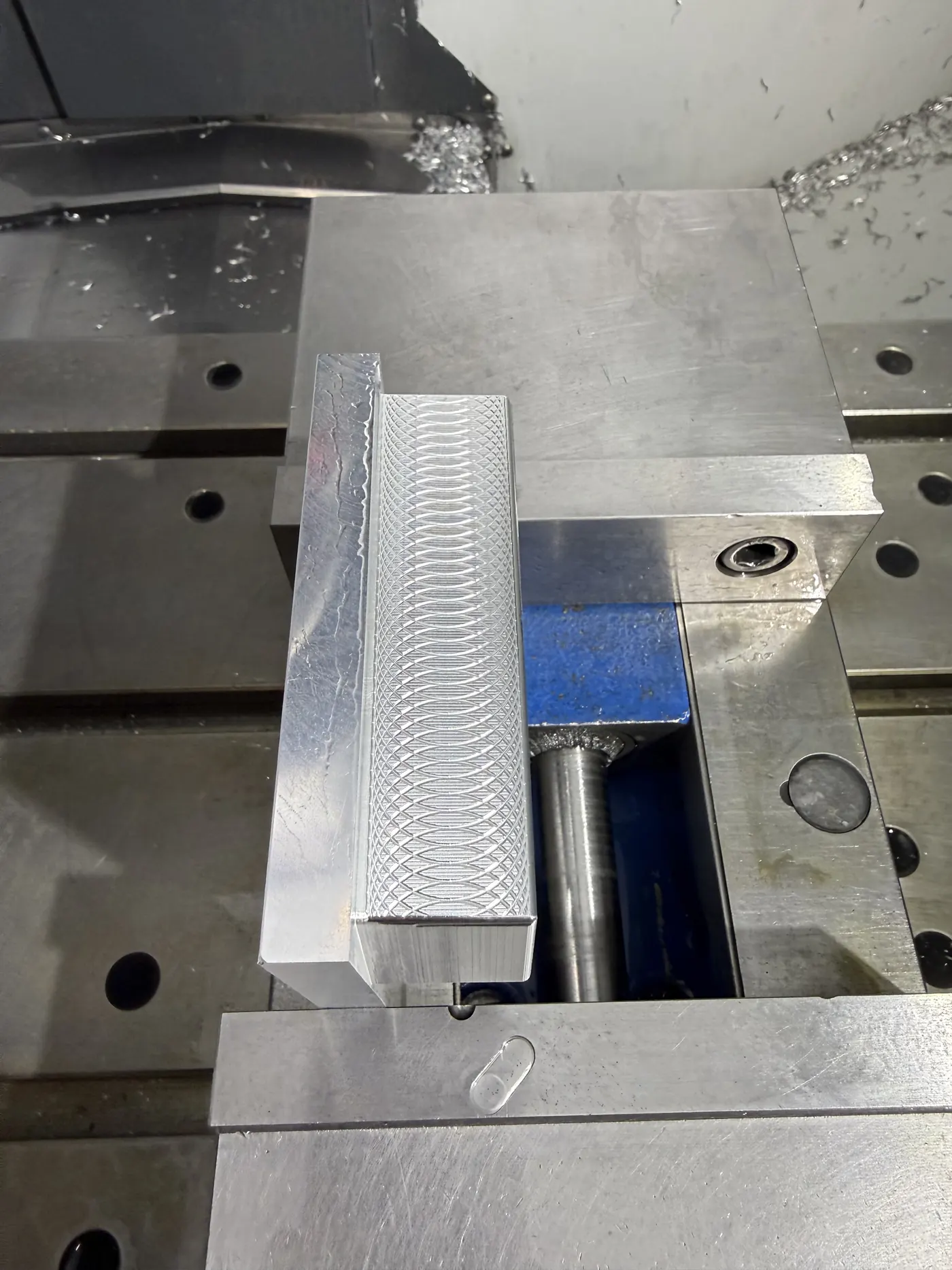 Close-up of the face-milling tool-mark pattern on the putter head