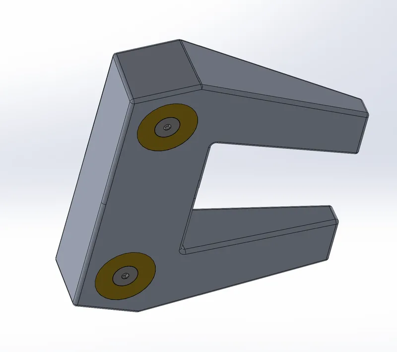 Putter head with brass weights installed, angled view